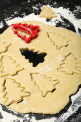 Cookie cutters, christmas tree bakery in flour.