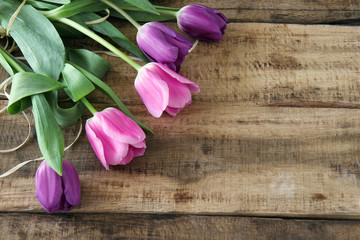 bouquet of tulips on wooden background