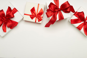 festive gift boxes with red bows