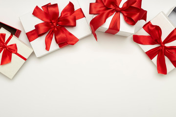 festive gift boxes with red bows