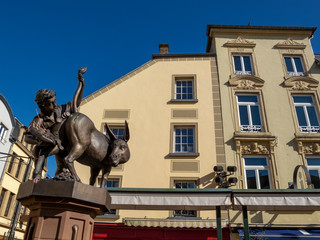 Ducat Donkey Fountain in Diekirch, Luxembourg with a boy and a donkey
