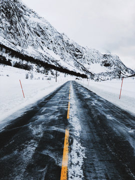 Driving Norway - Road Through Mountainous White Winter Landscape