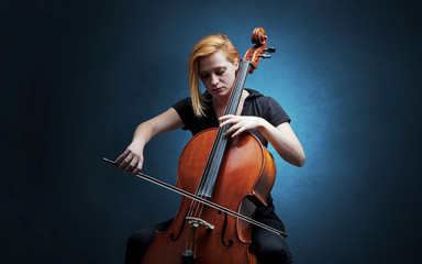 Lonely cellist composing on cello with nothing around  © ra2 studio