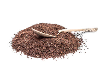 Heap of ground coffee with spoon on white.