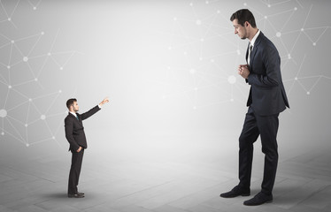 Small businessman aiming at a big businessman with connection and network concept
