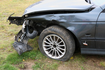Fototapeta na wymiar The front of a crashed broken passenger car