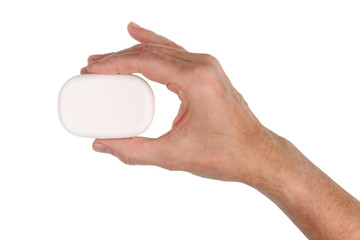 The old man holds in his hand a new piece of white toilet soap. Isolated