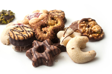 closeup of chocolate christmas biscuit assortment on white background