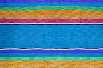 colorful striped fabric background, texture of folding beach chair.