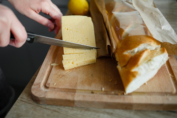 close-up of baguette and cheese cut