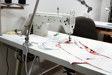 Sewing machine close up with colorful fabric material