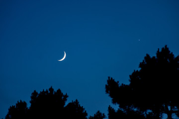 Fototapeta na wymiar Moon and Venus in the Northern Hemisphere