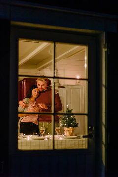 Fototapeta Loving couple having dinner in house