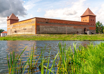 Outside View of Lida Castle behind the Castle Lake - Belarus