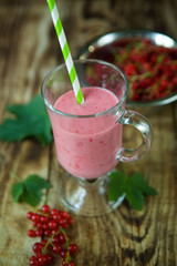 Cocktail or milk drink yogurt from red currant is poured into a glass bowl