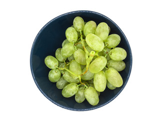 Bunch of green grapes in a plate isolated on white background