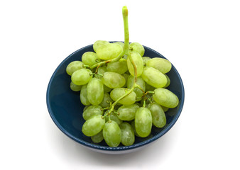 Bunch of green grapes in a plate isolated on white background