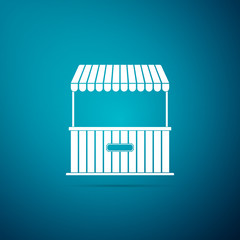7422199 Street stall with awning and wooden rack icon isolated on blue background. Kiosk with wooden rack. Flat design. Vector Illustration