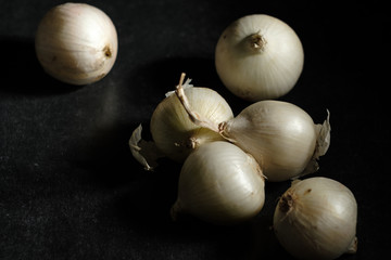 a variety of onions, white variety on the table dry mature for cooking dishes © mira_y