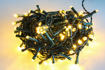 Tangled Christmas garland on white background