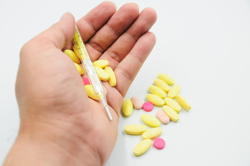 Colorful pills and medicines in the hand