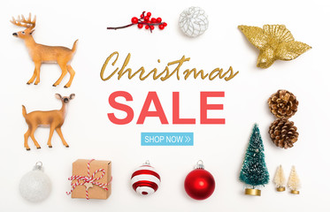 Christmas sale message with small Christmas ornaments on a white background