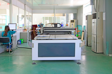 Large ink jet printers in a production workshop