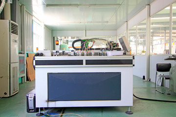 Large ink jet printers in a production workshop