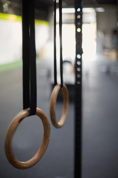 Gimnastic rings hanging  in a fitness club or gym