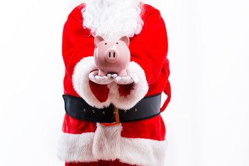 Santa holding a piggy bank isolated on white background