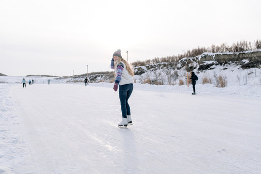 Woman blading on rink