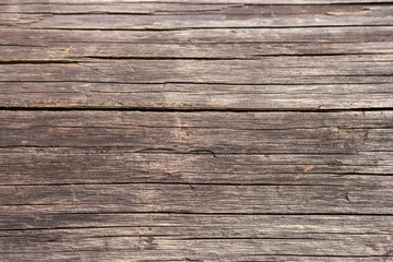 Obraz premium Brown wooden horizontal planks. Aged grunge wooden panels. Organic wall decoration. Hardwood boards. Wooden texture closeup. 