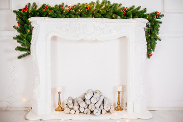 Beautiful Christmas room with decorateв, gifts on white fireplace. The idea for postcards. Place for text. Isolated