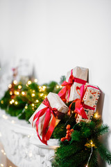 Beautiful Christmas room with decorateв, gifts on white fireplace. The idea for postcards. Place for text. Isolated