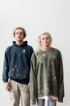 Portrait of a young couple dressed to renovate