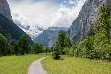 Fototapeta na wymiar View valley of waterfalls in city Lauterbrunnen, Switzerland, Europe