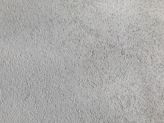Grey plaster texture. Architectural building material pattern with grains