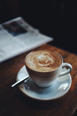 Cup of morning coffee and newspaper