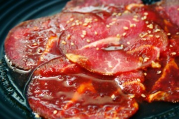 Raw beef slice for barbecue or Japanese style ,buffet grilled on hot coal at buffet restaurant.Premium Japanese wagyu grilled over charcoal on stove.Japanese or Korean food style.