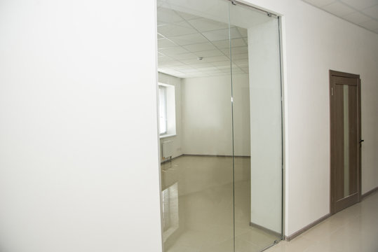 office corridor door glass, with door of light wood