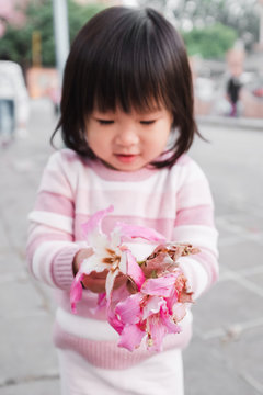 Asian little girl with Ceiba insignis flower