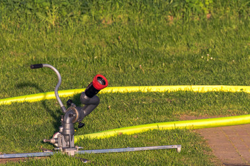 The fire department prepares the equipment and then exercises the use of water cannons. Concept: safety and protection or technology