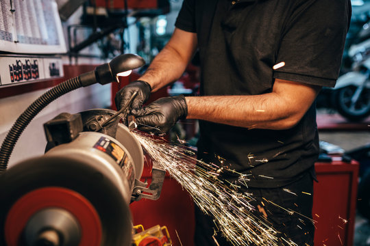 Mechanic working in the motorbike workshop