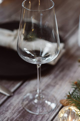 Wooden Table with Christmas decorations and garland, ware, green spruce branches