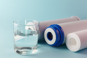Filter cartridges and a glass of water