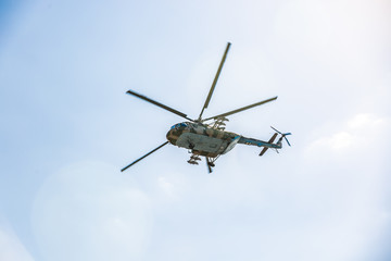 military helicopter flying during exercise performing a military demonstration