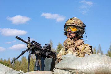 Fototapeta premium special forces, soldier assault rifle with silencer, optical sight. behind cover waiting in ambush
