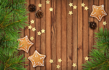 Christmas decorations and cookies on wood