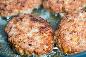 Minced cutlets are fried in a pan in boiling oil.