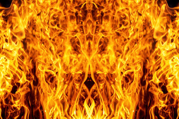 Abstract bright geometric ornament with orange-red elements on a black background, made up of tongues of fire_